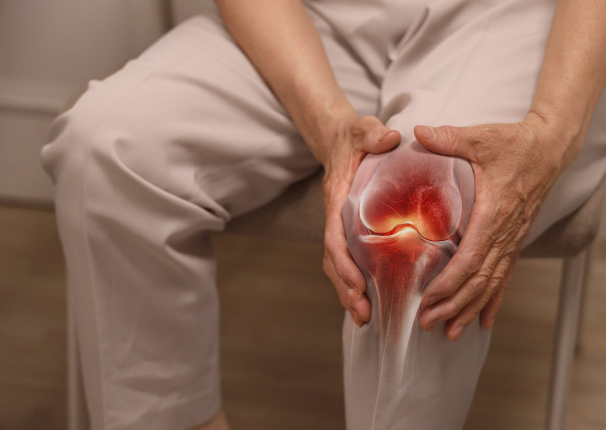 Illustration av en svullen knäled med inflammation markerad i rött